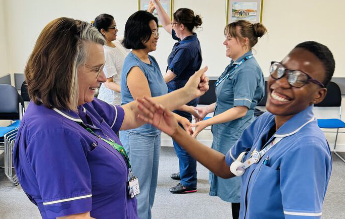 NHS Learners having physical in-person training to endure a visual style of learning, whereby they are learning hand-on practical techniques to use within their role.